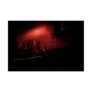 Taipei AC unit and pipes on a brick wall bathed in deep red night light, original photography postcard print